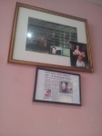 A newspaper cutting showing Anna Sher meeting the Queen is on the wall at Kigi Cafe.