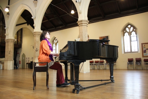 Alicia Montplaisir rehearsing on the grand piano at St Luke's West Holloway.